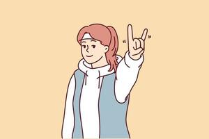 Young woman showing goat gesture demonstrating love for rock and roll to music. Girl in sweater with hood and bandage on head poses with smile after morning run. Flat vector illustration