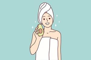 Woman in white towel after getting out of shower or bath recommends using avocado for cosmetic masks. Girl after completion of spa procedures demonstrates fruit that affects beauty. Flat vector image