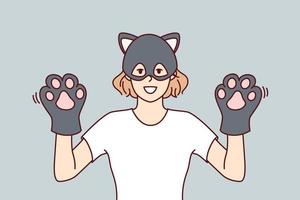 Funny woman in kitten mask demonstrates hands with gloves in form of pet paws. Cheerful young girl shows cool kitty costume for visiting carnival or children party. Flat vector illustration