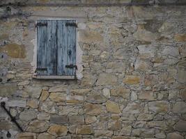 Old frassinedolo medieval village walls in valley around Bismantova stone near castelnovo ne monti photo