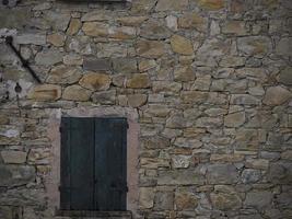 Old frassinedolo medieval village walls in valley around Bismantova stone near castelnovo ne monti photo