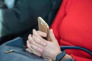 Hands while holding cellular smartphone photo