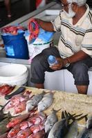 MALE, MALDIVES - MARCH, 4 2017 - People buying at fish market photo