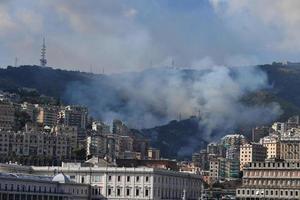 GENOA, ITALY - AUGUST 9 2017 - fire burning near town photo