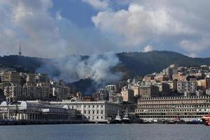 GENOA, ITALY - AUGUST 9 2017 - fire burning near town photo