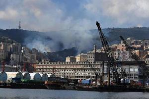 GENOA, ITALY - AUGUST 9 2017 - fire burning near town photo