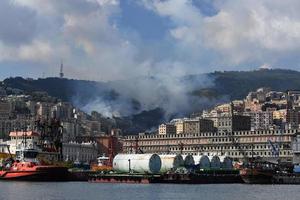 GENOA, ITALY - AUGUST 9 2017 - fire burning near town photo