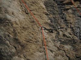 Rock Climber climbs on the Bismantova Stone in the Tosco Emiliano Appennino Park photo