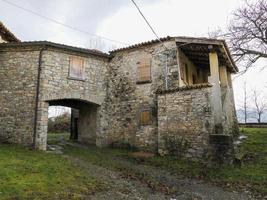 Old frassinedolo medieval village walls in valley around Bismantova stone near castelnovo ne monti photo