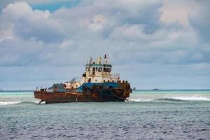 ship wreck on the reef photo