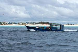 MALE, MALDIVES - MARCH, 4 2017 - People in the local ferry from island photo