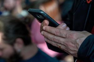 Hands while texting on cellular smartphone photo