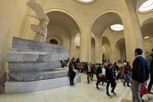 PARIS, FRANCE - APRIL 30, 2016 - Louvre museum crowded of tourist photo