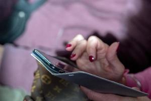 Hands while texting on cellular smartphone photo