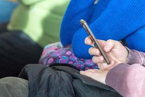 Hands while texting on cellular smartphone photo