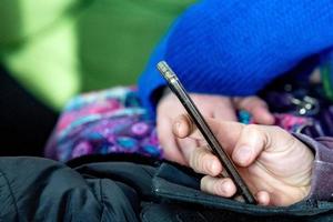 Hands while texting on cellular smartphone photo