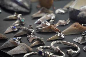 shark teeth pendant in jewelry store photo