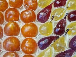 fresh glazed fruit sweet on display in pastry shop photo