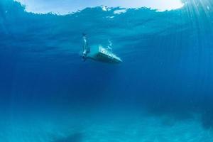 boat ship from underwater blue ocean photo