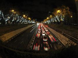 traffic jam in madrid castilla place at night with car lights tracks photo