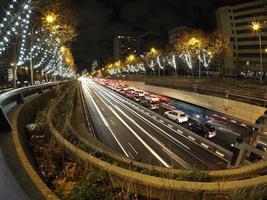 traffic jam in madrid castilla place at night with car lights tracks photo