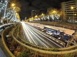 traffic jam in madrid castilla place at night with car lights tracks photo