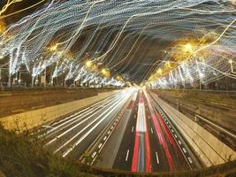 traffic jam in madrid castilla place at night with car lights tracks photo