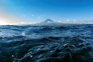 pico volcano view from ocean while swimming photo