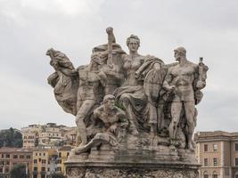 Statue of Sant'Angelo bridge during sunny day in Rome photo