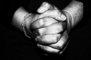 old retired woman crossed hands photo