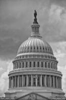 Washington DC Capitol detail on cloudy sky in black and white photo