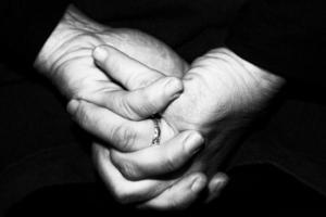 old retired woman crossed hands photo