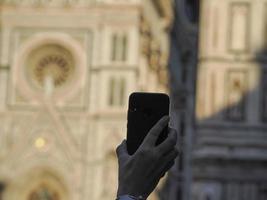 selfie with mobile in Florence dome santa maria del fiore detail photo