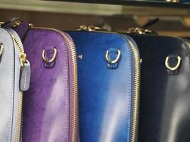 many different colors leather bags photo