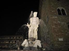 florence neptune statue della signoria place at night photo