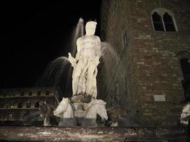 florence neptune statue della signoria place at night photo