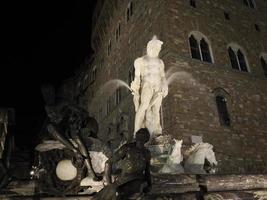 florence neptune statue della signoria place at night photo