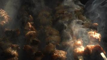 meat is roasted on coals with smoke video