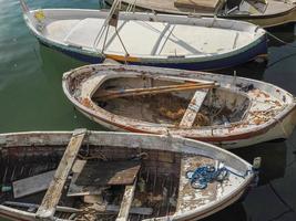 old abandoned small wooden fishing boat photo