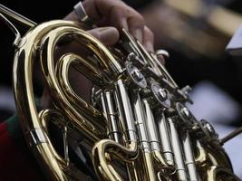 hands playing french horn photo