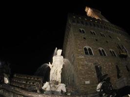 florence neptune statue della signoria place at night photo