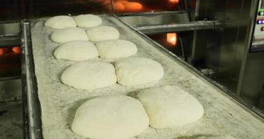 Prepared Bread Dough On A Tray At The Bakery - Ready For Baking - close up, slow motion