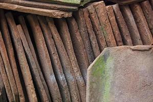 pile of old terracotta rooftiles, Close up. Textured summer background. photo