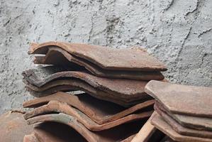 pile of old terracotta rooftiles, Close up. Textured summer background. photo