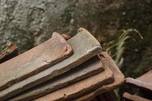 pile of old terracotta rooftiles, Close up. Textured summer background. photo