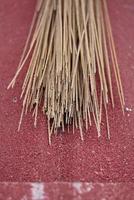 selective focus of a broom stick on color  background photo