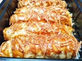 baked homemade cheese pastry on baking tray photo