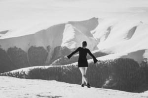 Female model in dress on mountain monochrome scenic photography photo