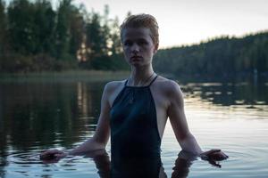 Close up pretty woman wearing swimsuit in lake portrait picture photo