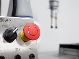 Push control button red pink orange color symbol equipment panel switch machine steel industry engineer energy power electronic system work job occupation technology arm tool robot automation object photo